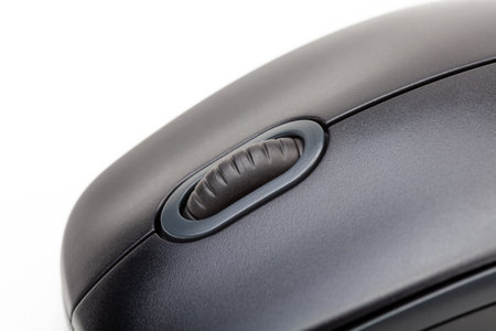 Plain simple new black computer mouse scroll wheel part macro, extreme closeup, detail shot. Office equipment, pc, laptop accessories, app user interaction, interface control abstract concept, nobodyの写真素材