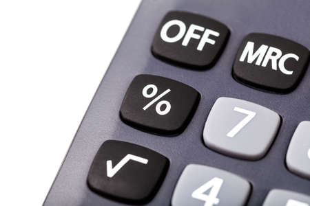 Percentage symbol % on a simple calculator button, macro, extreme closeup. Calculating percentages,...