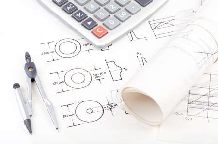 Fiber optics schematics, blueprints on the table, electrical engineering, networking modern technology, nobody. Tools, paper and calculator. Science, technical studies, learning and design conceptの写真素材