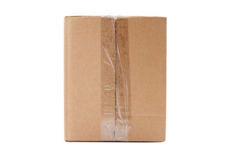 One single simple clear taped rectangle brown carton box parcel, blank closed package isolated on...