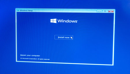 Microsoft Windows 10 OS operating system installation screen, cursor clicking the install now button on the screen, computer device display closeup, detailのeditorial素材