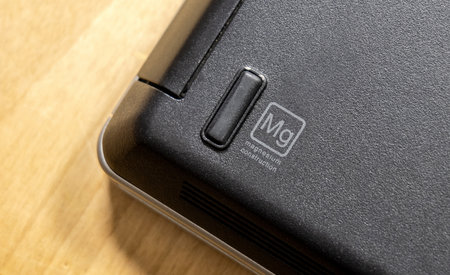 Magnesium construction logo sign, symbol, indicator on a laptop case, detail, object closeup, nobody. Magnesium alloy shell material engineering conceptのeditorial素材