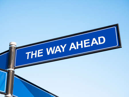 The Way Ahead text, blue city street signpost, guidepost, sign post. Simple urban street name sign, guide post object. Journey progress, business motivation, going ahead abstract concept, nobodyの写真素材