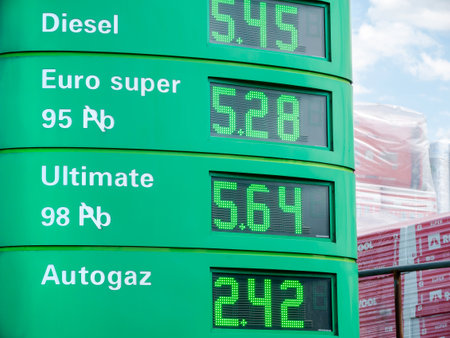 Gas prices on an electronic digital display, BP petrol station fuel prices rising, falling simple news concept, nobody. Price, numbers closeup, PLN currencyのeditorial素材