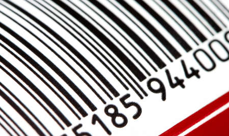 Part of a barcode on a simple drink tin can, bar code tag label object rolling in, detail, macro, extreme closeup, nobody. Food products origin, retail business and consumerism abstract conceptの写真素材