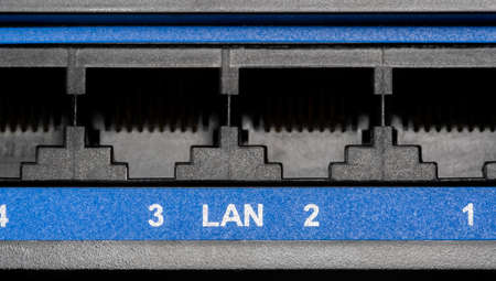 Multiple LAN switch router RJ-45 Ethernet ports internet connection sockets object detail, extreme closeup, nobody, no people. Local area network switch ports macro, networking, cyber security conceptの写真素材