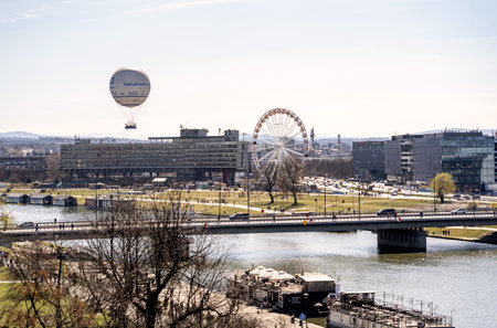 Europe, Krakow, Poland, Vistula River Hotel Forum boulevard river bank panorama, cityscape. Balloon, ferris wheel, wide city view, simple urban landscapeのeditorial素材