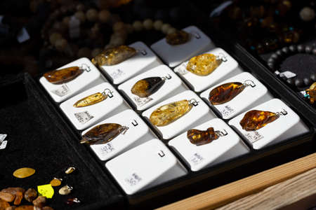 Amber jewelry on sale, baltic amber pendants, group of objects, detail, extreme closeup, nobody....