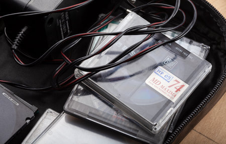 A bag full of Sony Mini Discs for an old retro voice recorder, MD, retro voice recording equipment, 90s audio rec technology abstract concept, group of objects, nobodyのeditorial素材