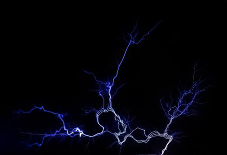Electrical lightning bright white blue sharp electric energy detail on black background. Power generation, electricity, high voltage abstract concept, nobody, no people. Thunderbolt, flash, dischargeの写真素材