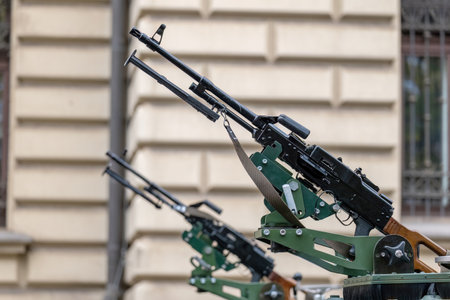 Closeup of a collection of vehicle-mounted machine guns with barrels pointing up, nobody. Urban...