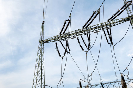 Electrical substation power station equipment partial detail on a cloudy sky background, no people....