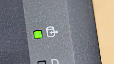 Green laptop HDD hard drive activity light indicator LED macro, extreme closeup detail shot Moving, copying files, data backup, NAS network attached storage RAID arrays simple concept, symbol, nobodyの写真素材