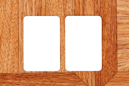 Two blank white rectangular cards on wooden surface, empty paper mockup template with copy space, top view shot, minimalist design, business branding concept, clean background, symmetrical, nobodyの写真素材