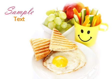 breakfast including egg, toast, fruits の写真素材
