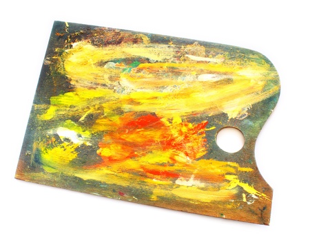 art palette with blobs of paint isolated on whiteの写真素材