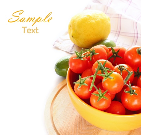 Tomatoes and cucumber isolated on white background の写真素材