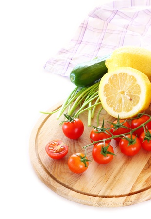 Tomatoes and cucumber isolated on white background の写真素材