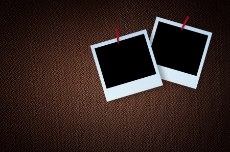 Polaroid photo frame on textured brown canvasの写真素材