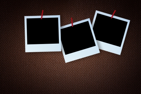 Polaroid photo frame on textured brown canvasの写真素材