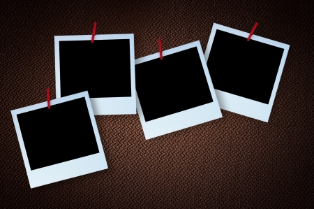 Polaroid photo frame on textured brown canvasの写真素材