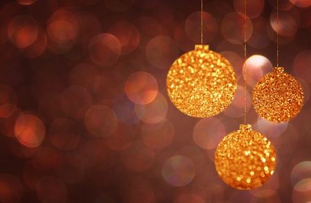 christmas background with brown bokeh lights and christmas balls の写真素材