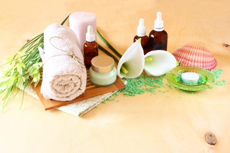 Spa and wellness setting with natural soap, candles and towel  natural wooden background   green color set の写真素材