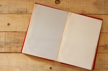 open vintage book on wooden tableの写真素材