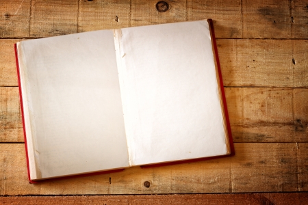 open vintage book on wooden tableの写真素材