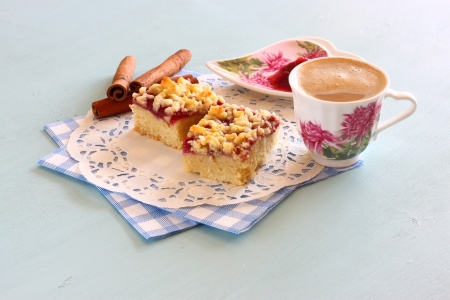 cherry cake, coffee cup and jam on wooden table backgroundの写真素材