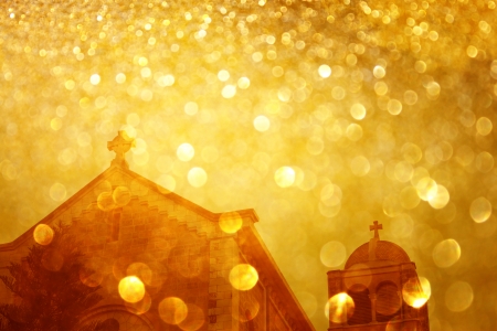 glitter golden lights glowing over crossの写真素材