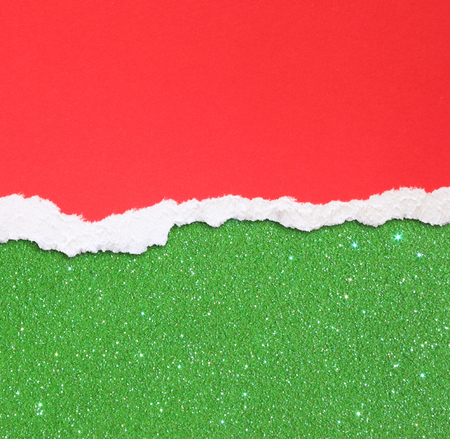 red torn paper over green glitter backgroundの写真素材