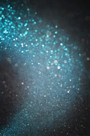 glitter trail with blue and black lights with star dustの写真素材
