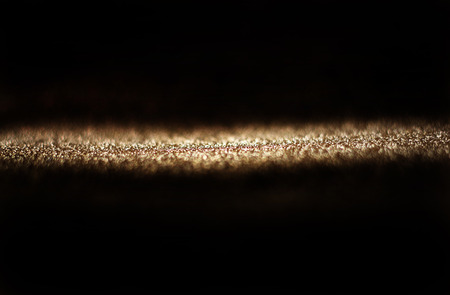 gold glitter trail  abstract bokeh lightsの写真素材
