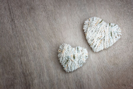 hearts hanging over wooden textured  の写真素材