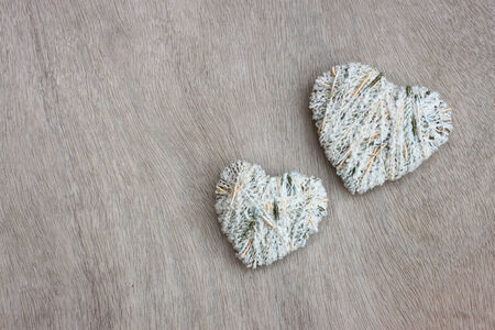 hearts hanging over wooden textured  の写真素材