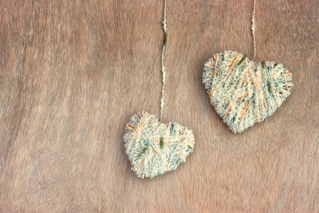 hearts hanging over wooden textured の写真素材