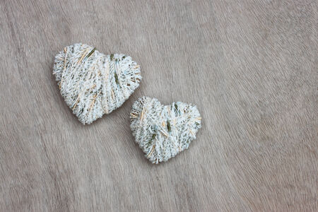 hearts hanging over wooden textured の写真素材