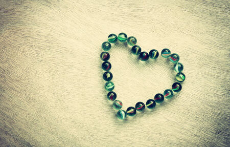 heart shape made from marbles with vintage effect  valentines day concept or wedding concept  room for text の写真素材