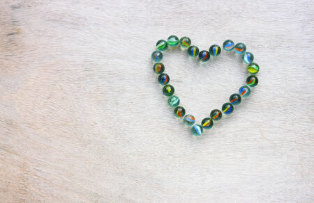 heart shape made from marbles with vintage effect  valentines day concept or wedding concept  room for text の写真素材