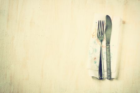 top view of silver fork and knife over wooden textured room for text   の写真素材