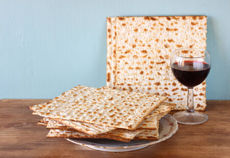 passover background  wine and matzoh  jewish passover bread   over wooden background  の写真素材