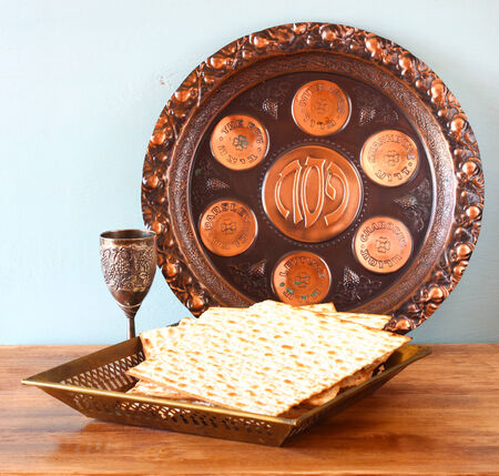 passover background  plate, wine and matzoh  jewish passover bread  over wooden background  の写真素材