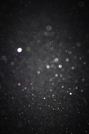 glitter vintage lights background  light gold and black  defocused   の写真素材