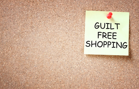 guilt free shopping concept  sticky pinned to board and room for text   の写真素材
