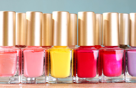 Group of bright nail polishes over wooden board  retro filter  room for text  の写真素材