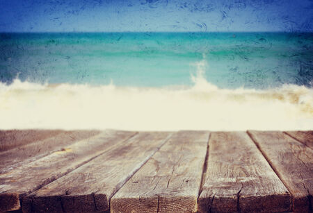 wood deck in front of beach landscape  ready for product dispaly  textured image  の写真素材