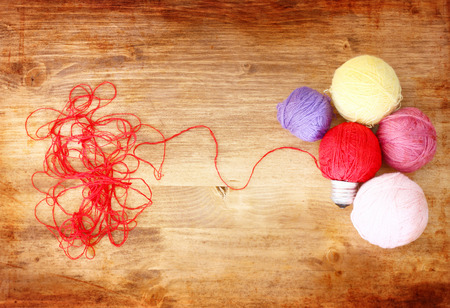 wool light bulb   idea or inspiration concept on wooden background  の写真素材