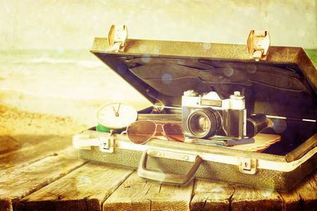 old case with books and vintage camera on top  travel or adventure concept  の写真素材