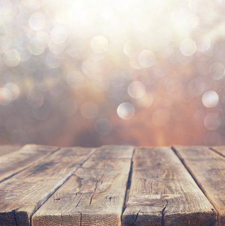 wood board table in front of summer landscape with lens flare   の写真素材
